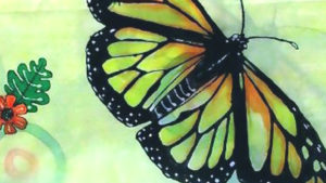 Silk painting with monarch butterfly motif painted on it