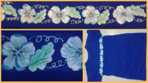 Row of hand painted cherry blossom on blue cotton kurthi material