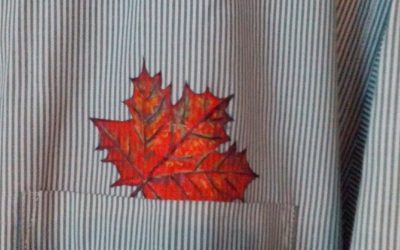 maple leaf painted on shirt above the pocket