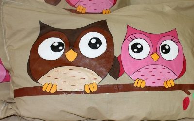 owl motif painted on pillow cover