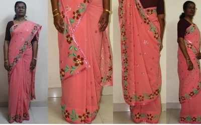 floral design painted on peach coloured saree