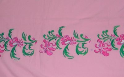 floral design painted on peach coloured saree